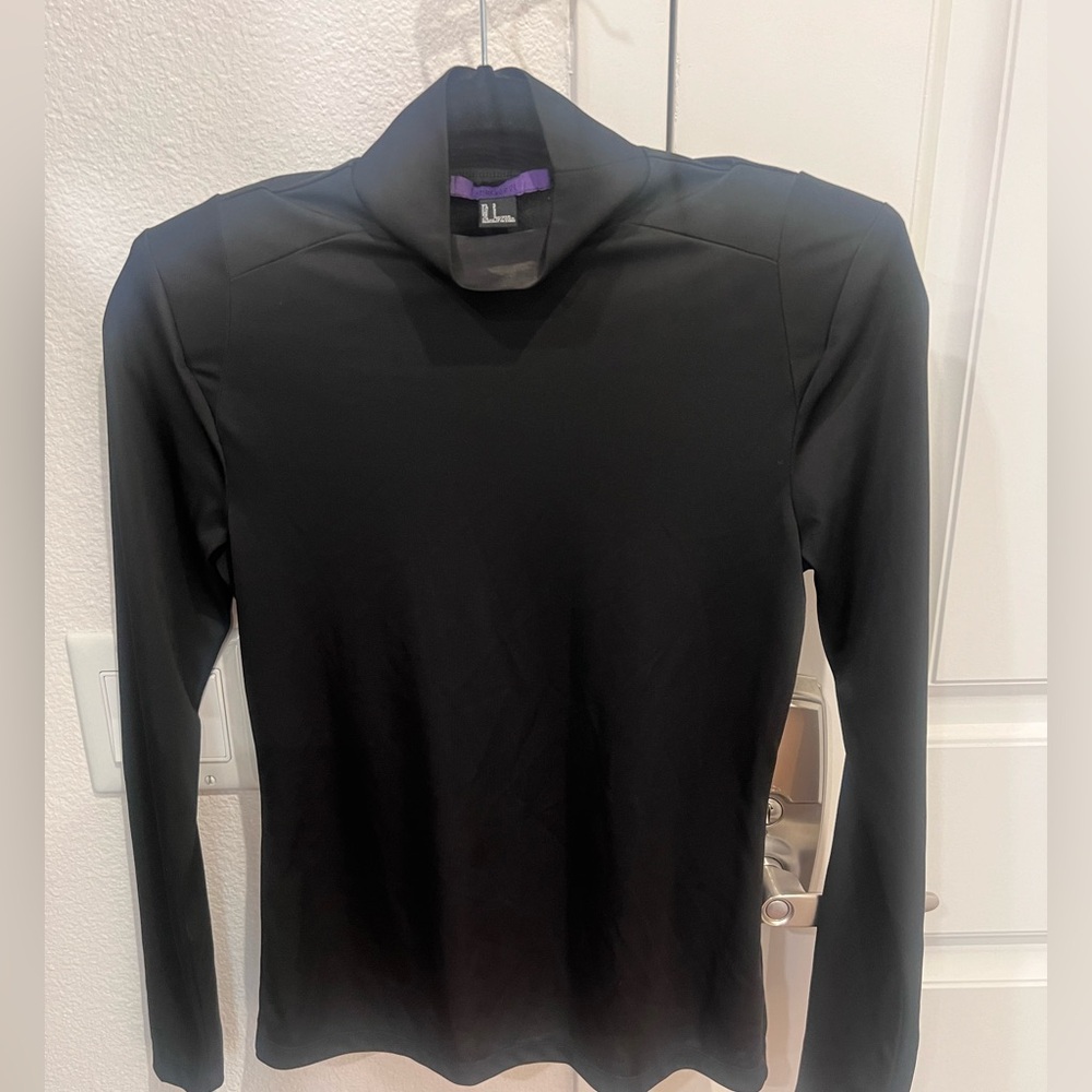 Black turtleneck with shoulder pads